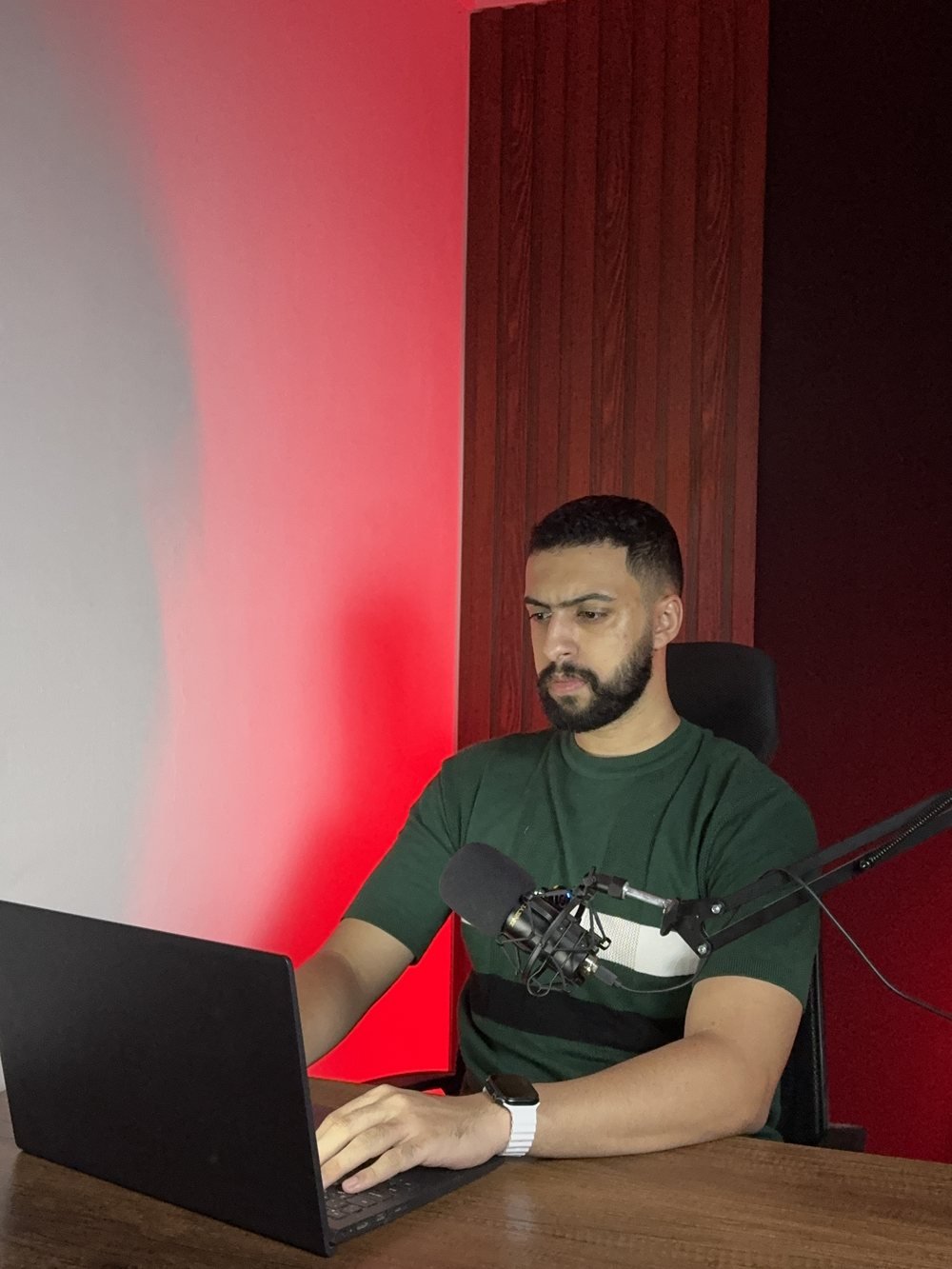 Zeyad Hani writing content at his desk